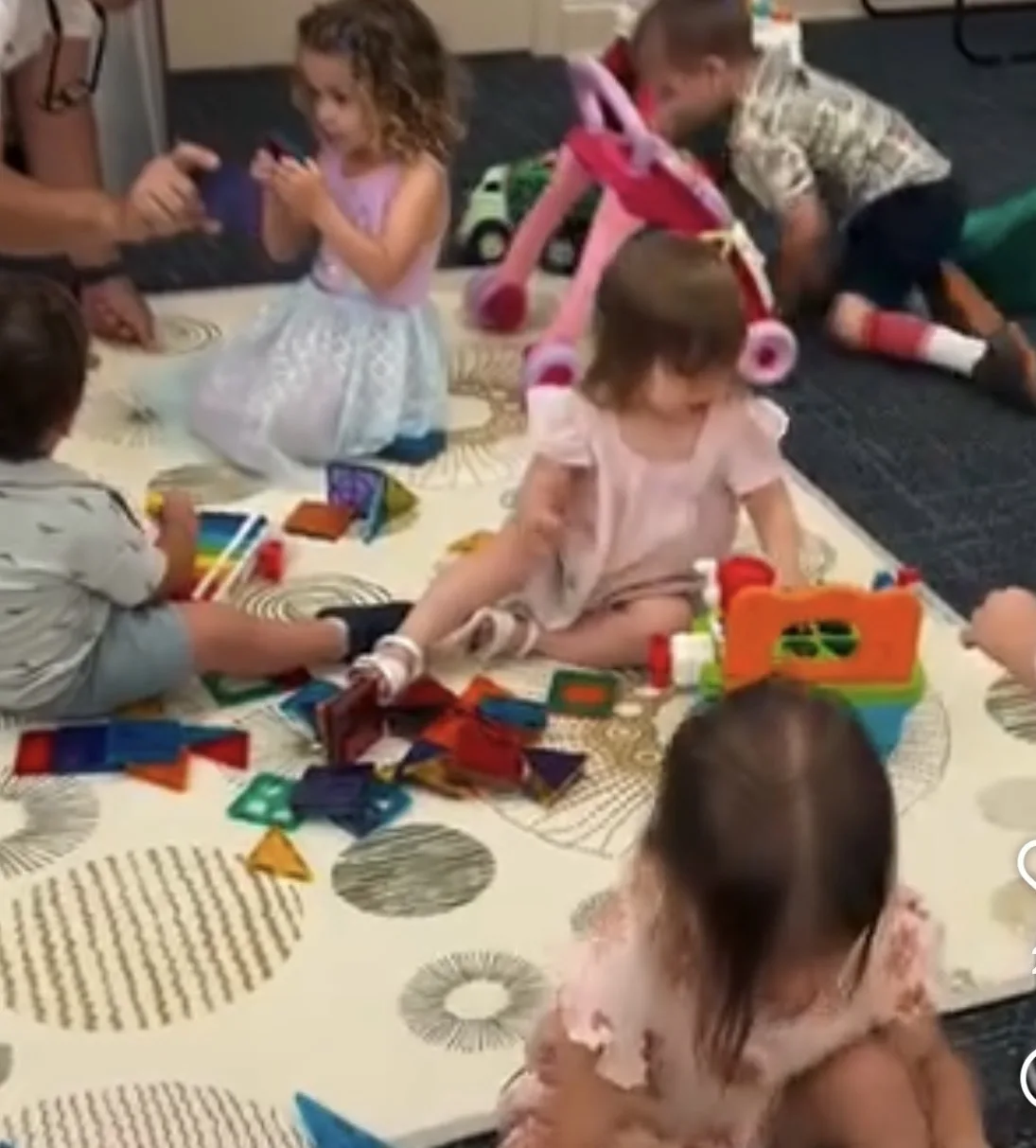 Young children playing together in the nursery classroom