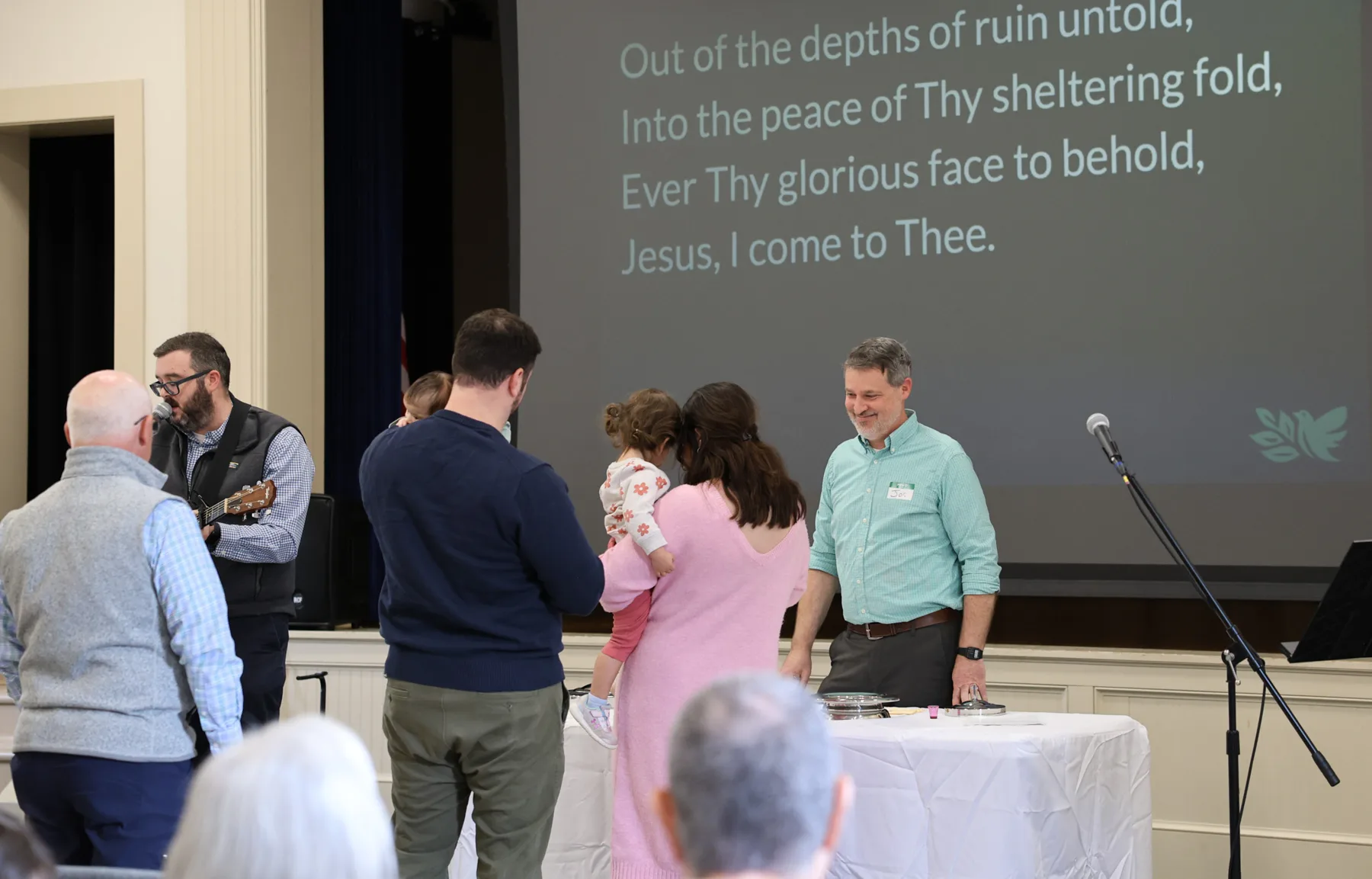 Leading worship at the front of the room on a Sunday morning